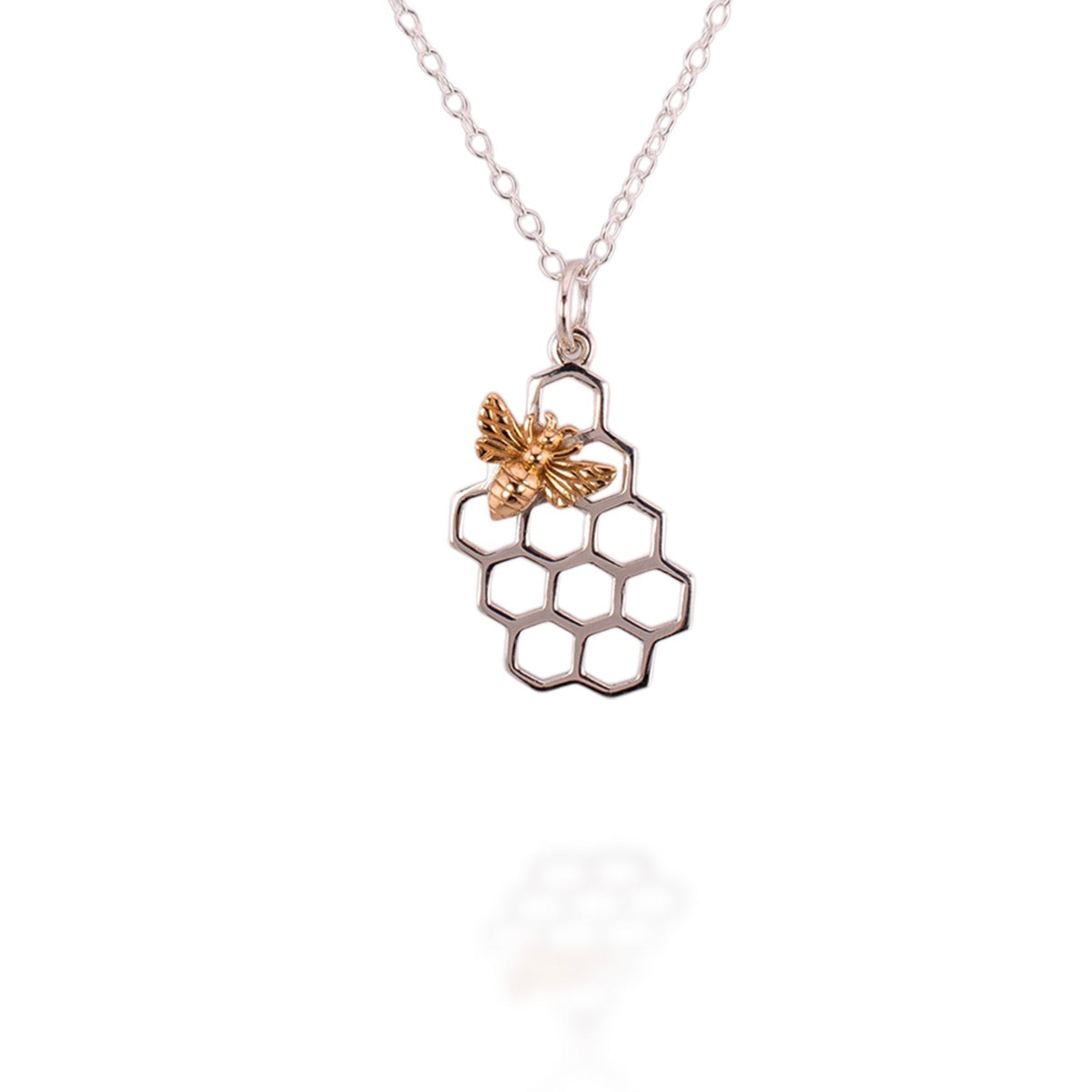 Necklace with a honeycomb and bee pendant on a white background