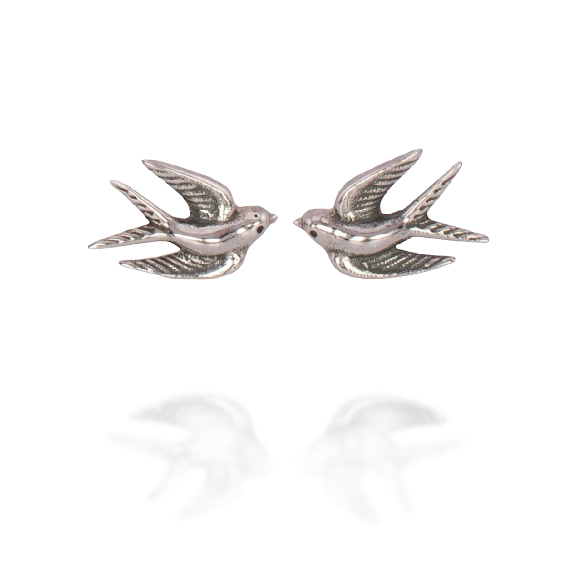 Sterling silver post earrings shaped like swallows in mid-flight, with detailed wings and bodies.