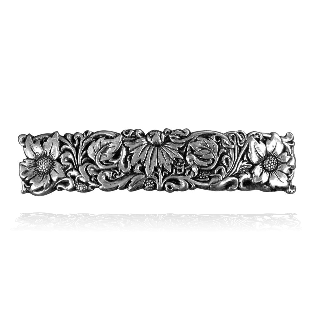 Silver 70mm barrette with intricate wildflower and leaf design, featuring daisies and berries.